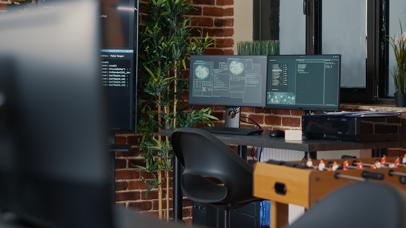 desk with multiple computer monitors displaying ne pmbwc2a.jpg